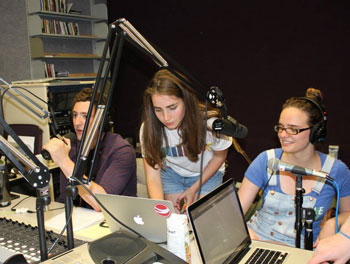 Peter Raffel, left, Abby Schubach and Morgan Gray participate in last year's "Radio for Rwanda." Photo courtey of GlobeMed