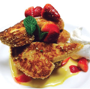 Housemade Brioche French Toast with Lemon Curd Sauce and Fresh Berries. Photo courtesy of Village Hearthstone  Restaurant & Catering